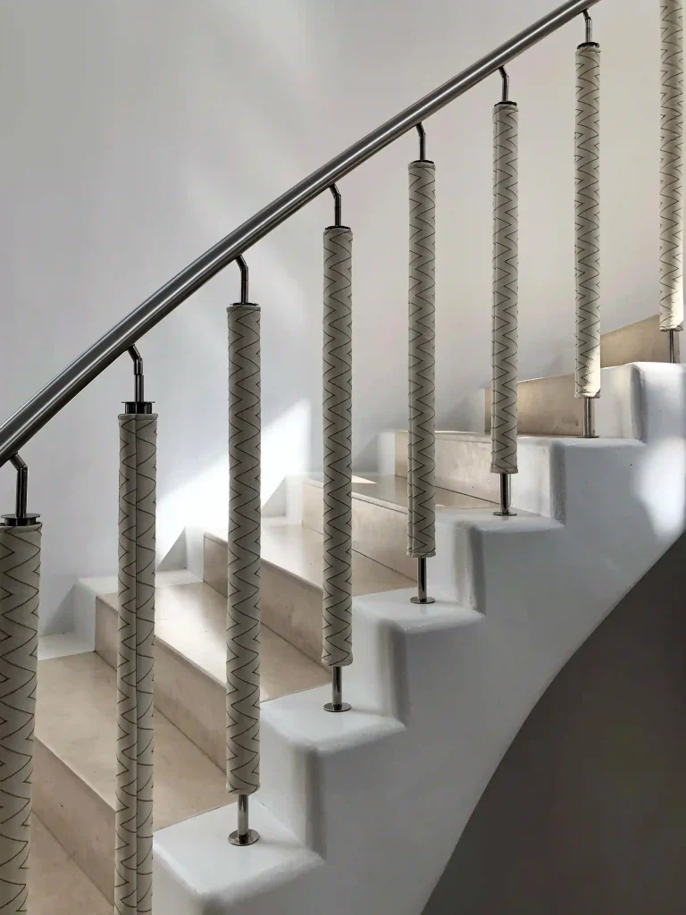 Elegant staircase with rope handrail in a calm interior setting